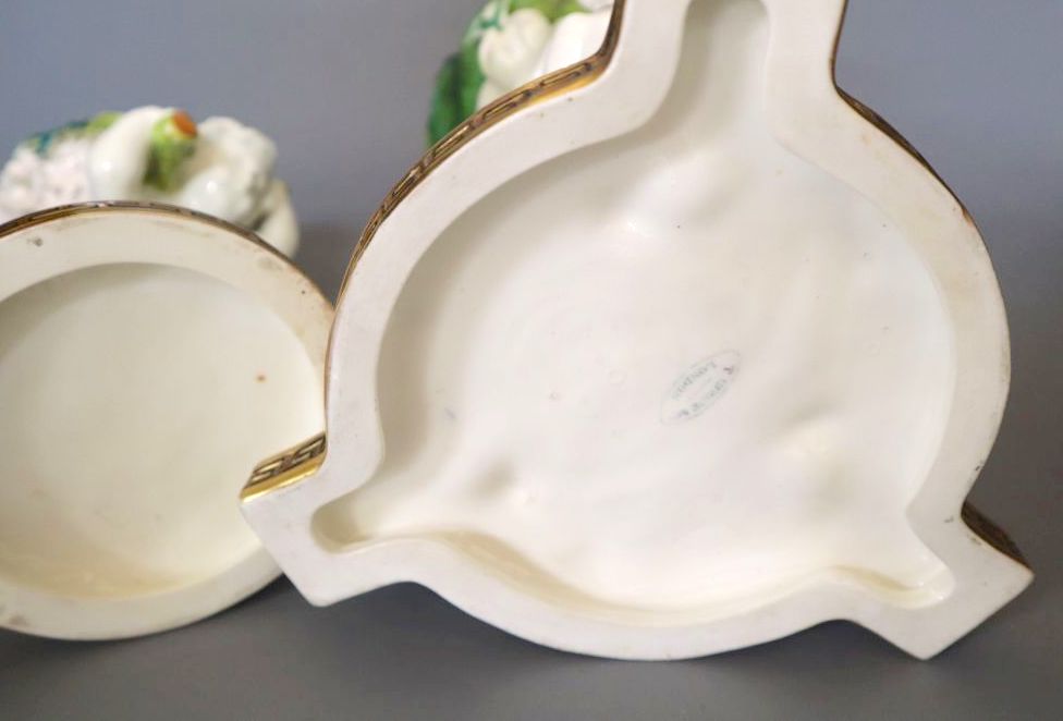 Two Moores cherub pot pourri bowls, retailed by T. Goode & Co, tallest 20cm
